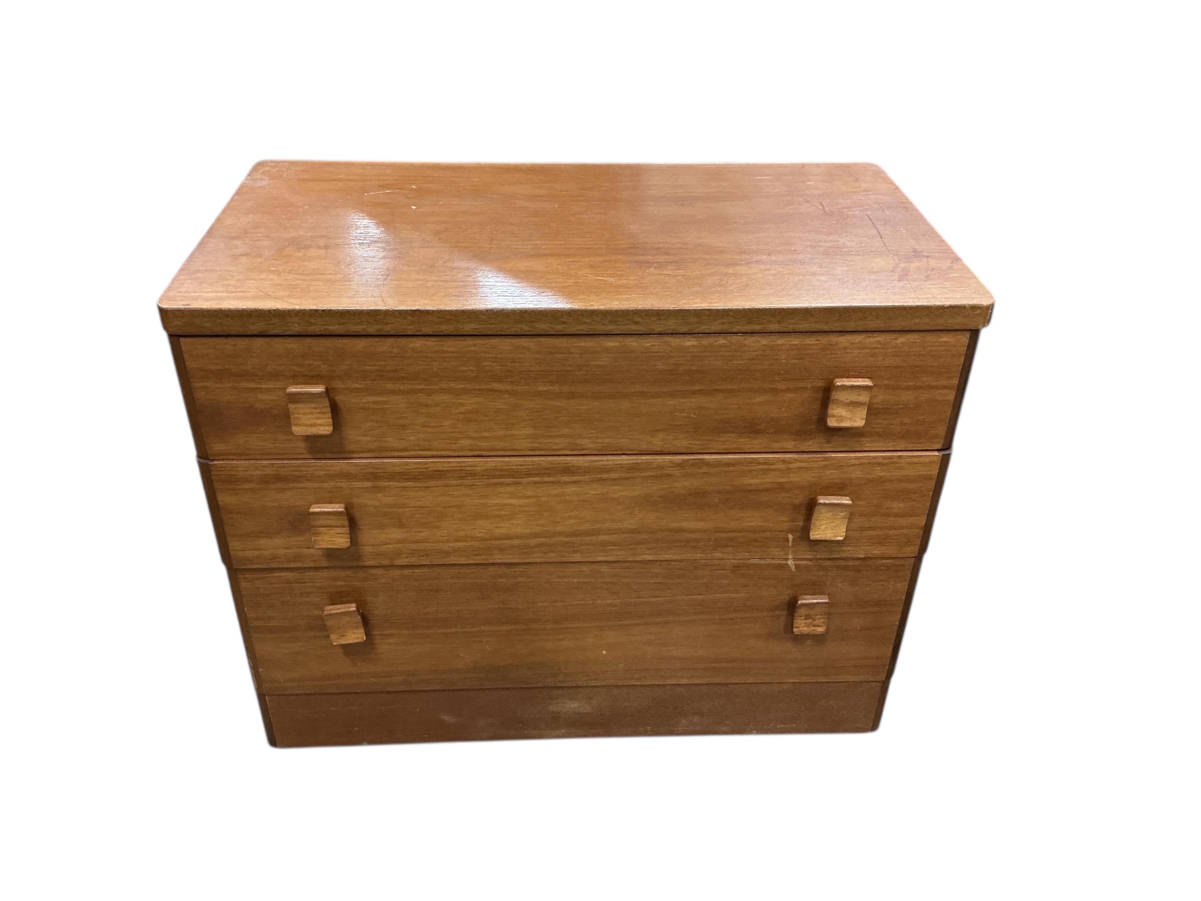 A small mid century Stag teak three drawer chest and a four drawer chest, larger width 80cm, depth 43cm, height 63cm